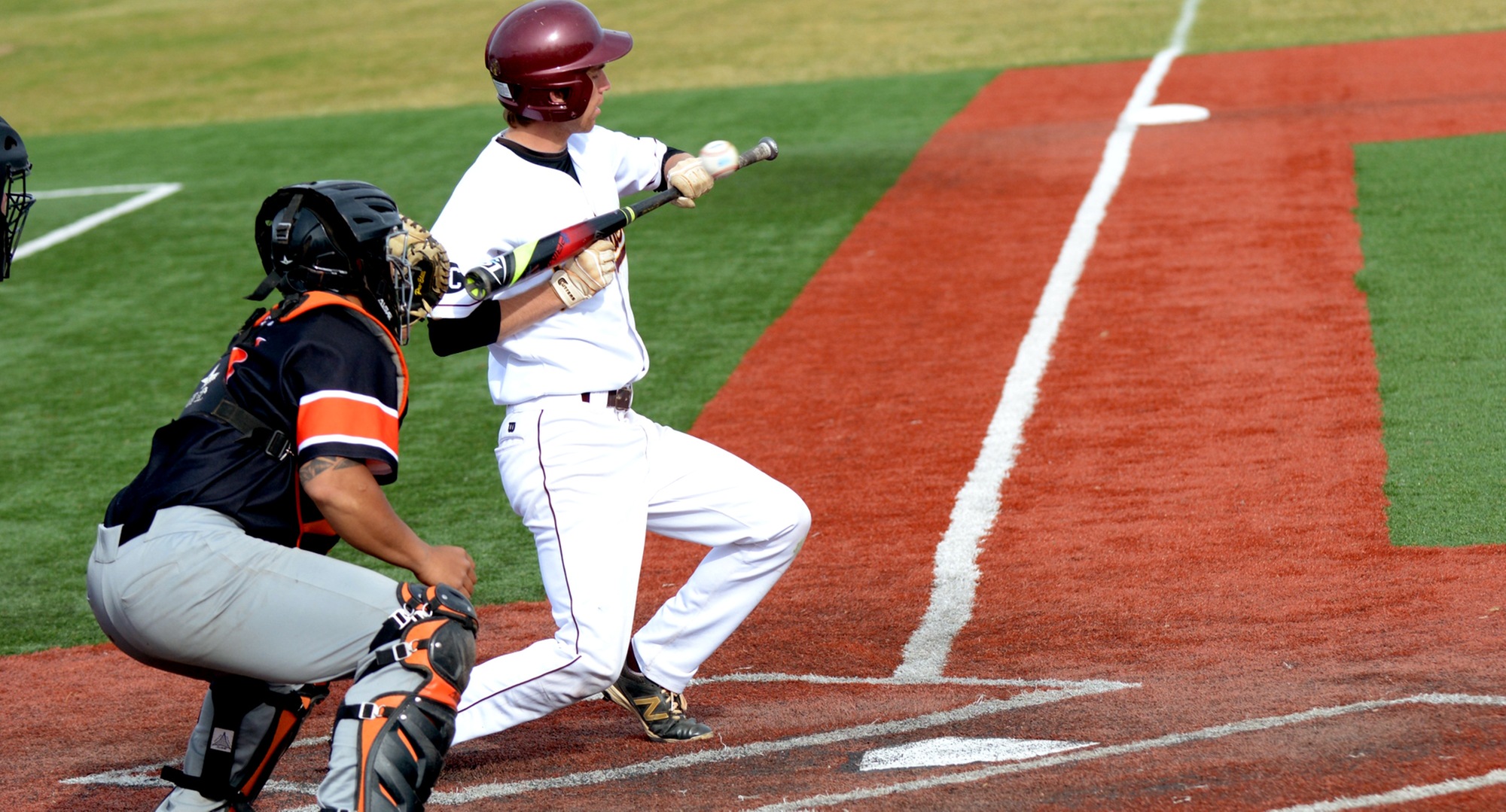 Nate Hoeft ducks and pulls the bat back as he tries to get down a sacrifice bunt during the Cobbers' 10-9 win over Jamestown.