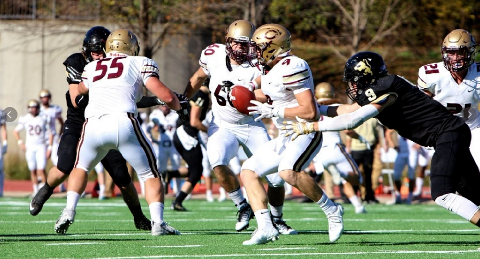 Junior quarterback Michael Herzog looks for running room in the Cobbers' win at St. Olaf (Photo courtesy of St. Olaf Sports Information)