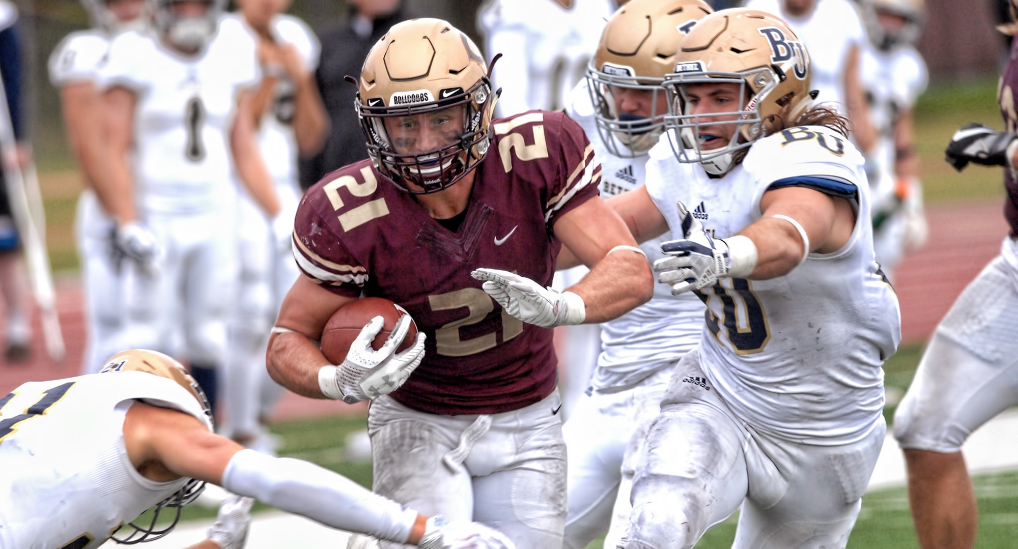 Chad Johnson breaks through three Bethel tacklers on his way to rushing for 191 yards in the MIAC-opening win for the Cobbers.