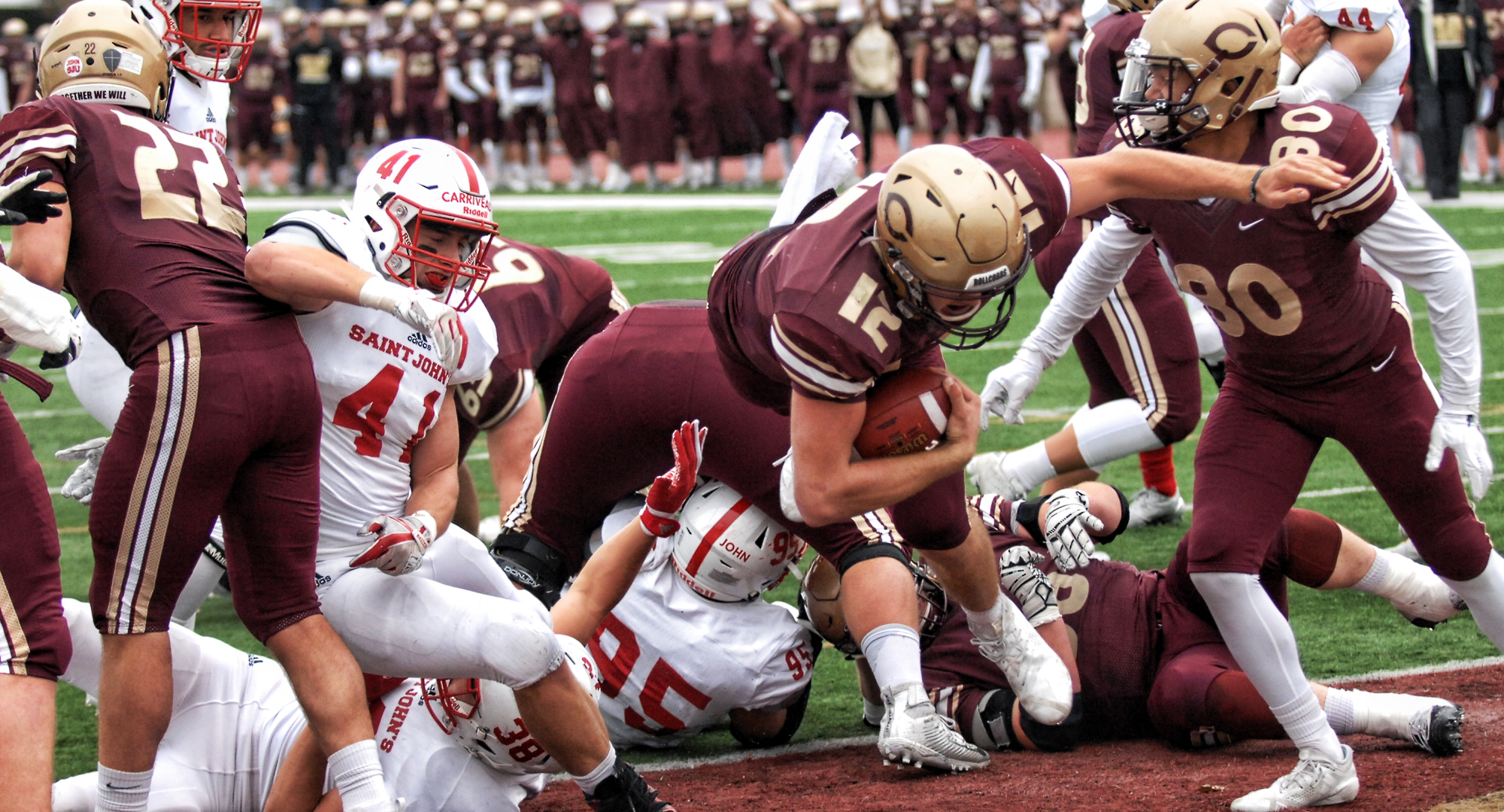 Junior quarterback Blake Kragnes dives into the end zone in the first quarter of the Cobbers' game with St. John's.