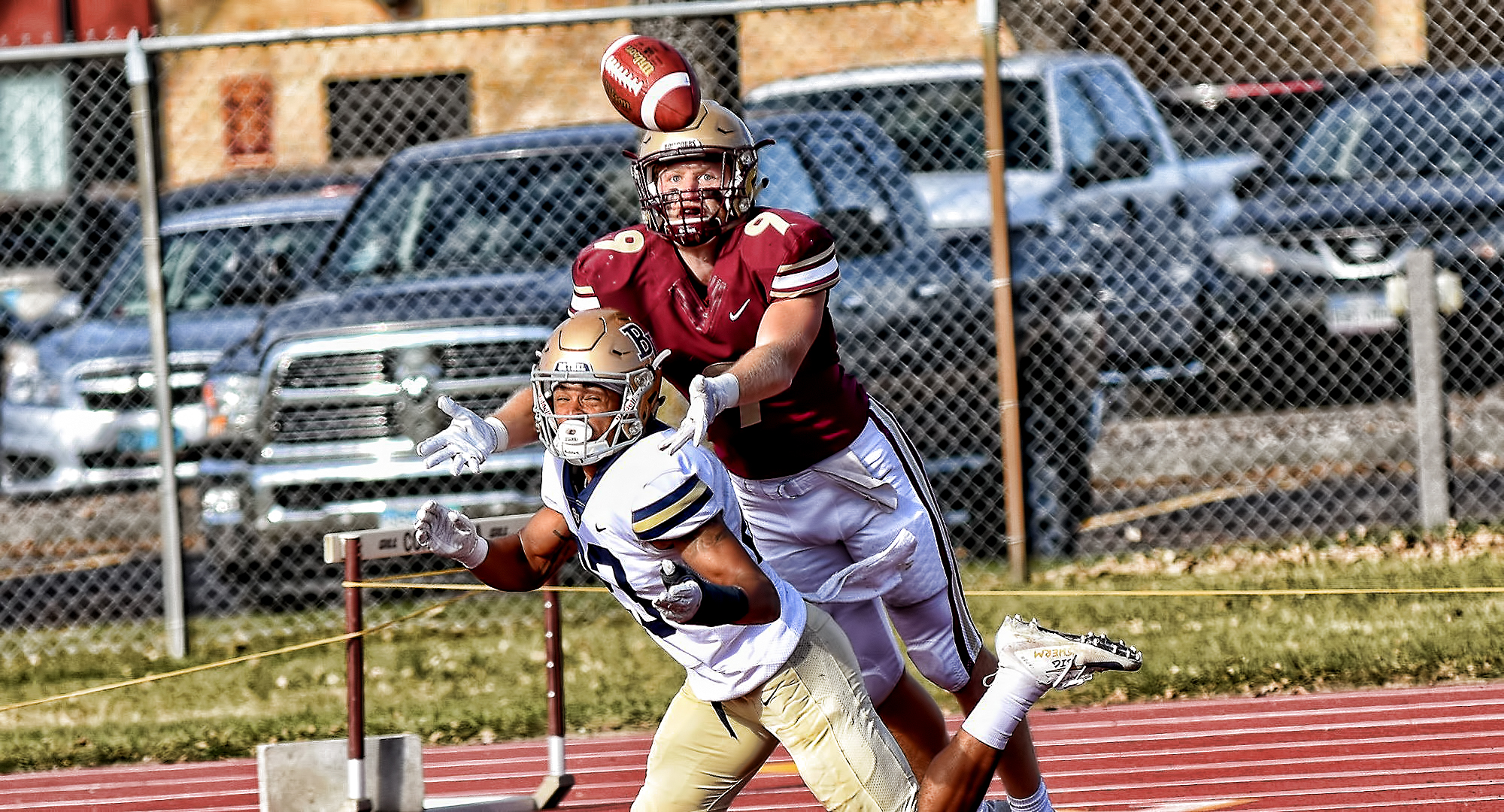 Senior Matt Bye goes over a Bethel defender to try and make a catch during the Cobbers' game with the Royals.