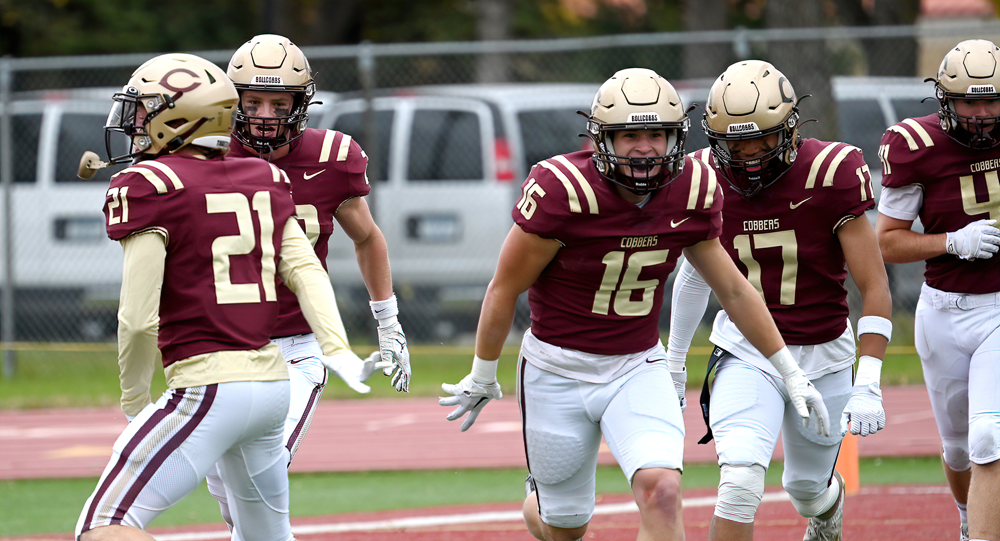 Griffin Decker (#16) celebrates his 4th-quarter interception during the Cobbers' 49-8 win over Macalester.