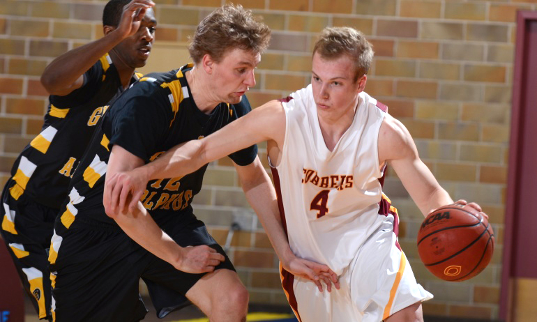 Tom Fraase dribble the ball up court in the Cobbers' wn over Gustavus. Fraase had a season-high 17 points vs. the Gusties.