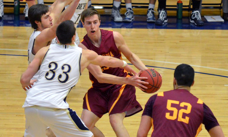 Jordan Bolger finds the going tough around the Bethel basket in the Cobbers' playoff game. (Photo courtesy of Matt Higgins)