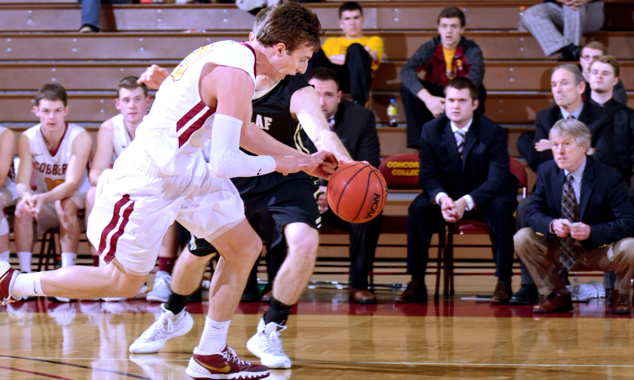 Jordan Bolger gets the steal and is fouled during the second half of the Cobbers' 62-61 win over St. Olaf. Bolger finished with a career-high 26 points.