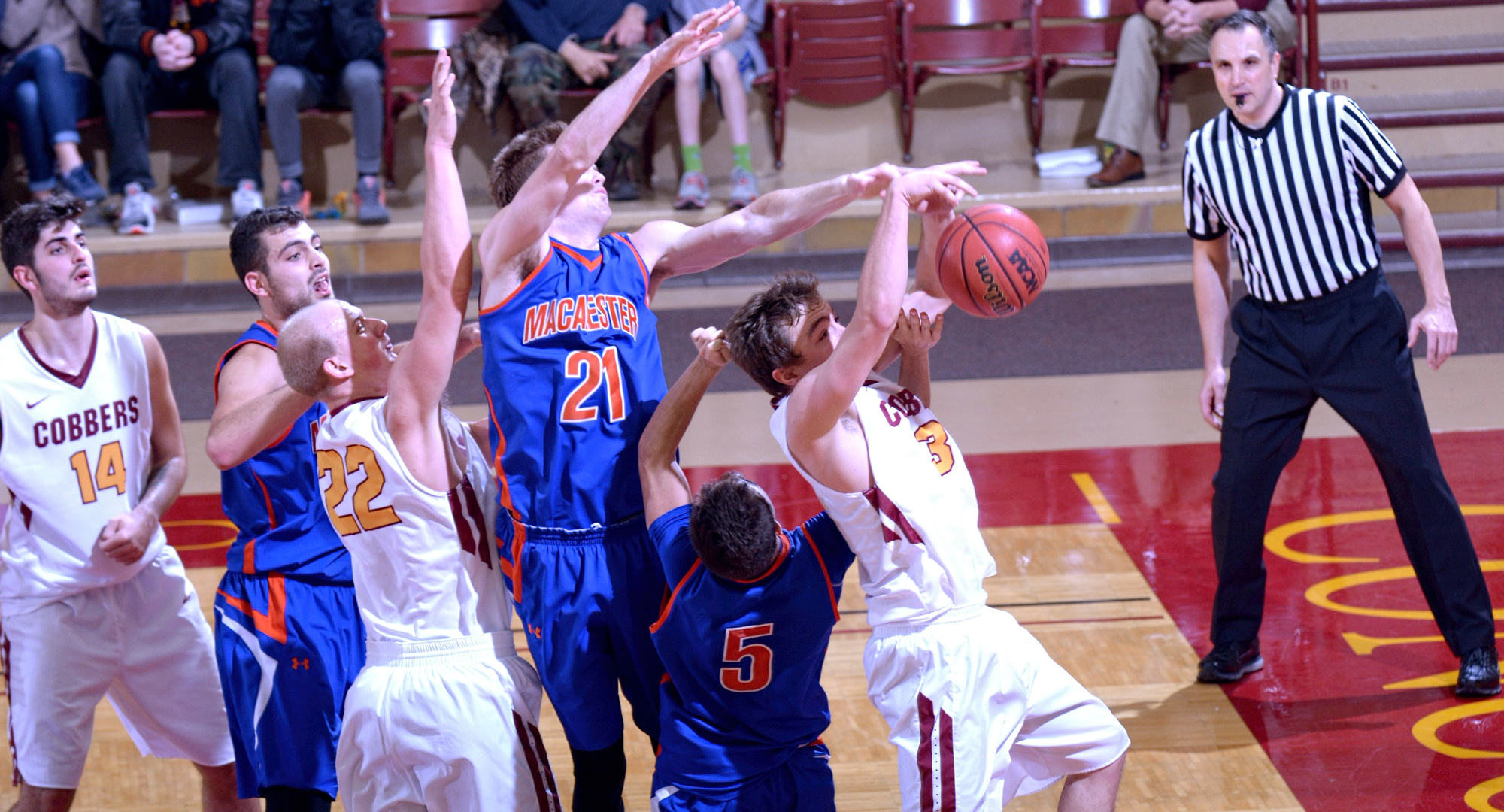 Senior Zach Kinny drives the lane during the Cobbers' game on Monday with Macalester. Kinny went 5-for-10 from the floor and finished with 16 points.