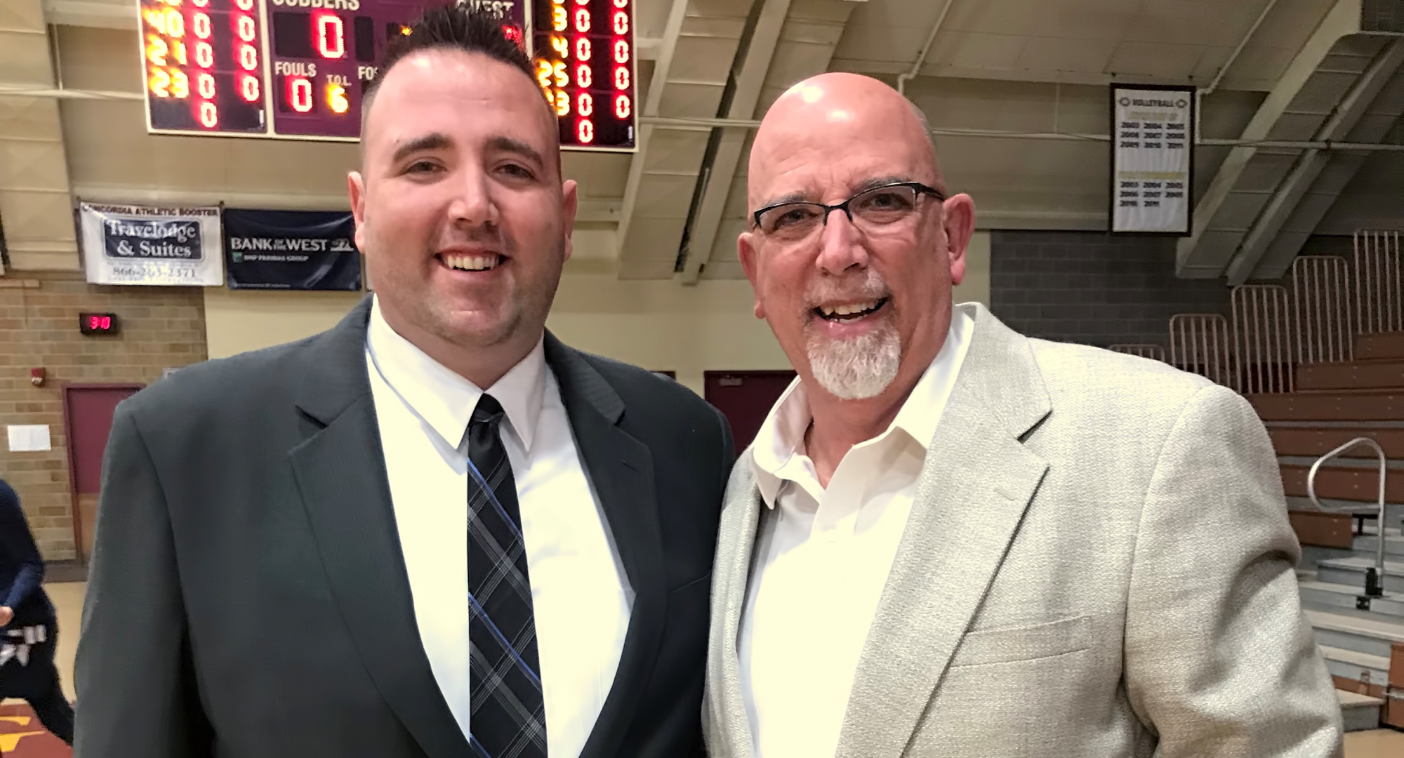 Cobber head coach Grant Hemmingsen (L) and his Dad George pose for a picture before Concordia's game with Bethel.
