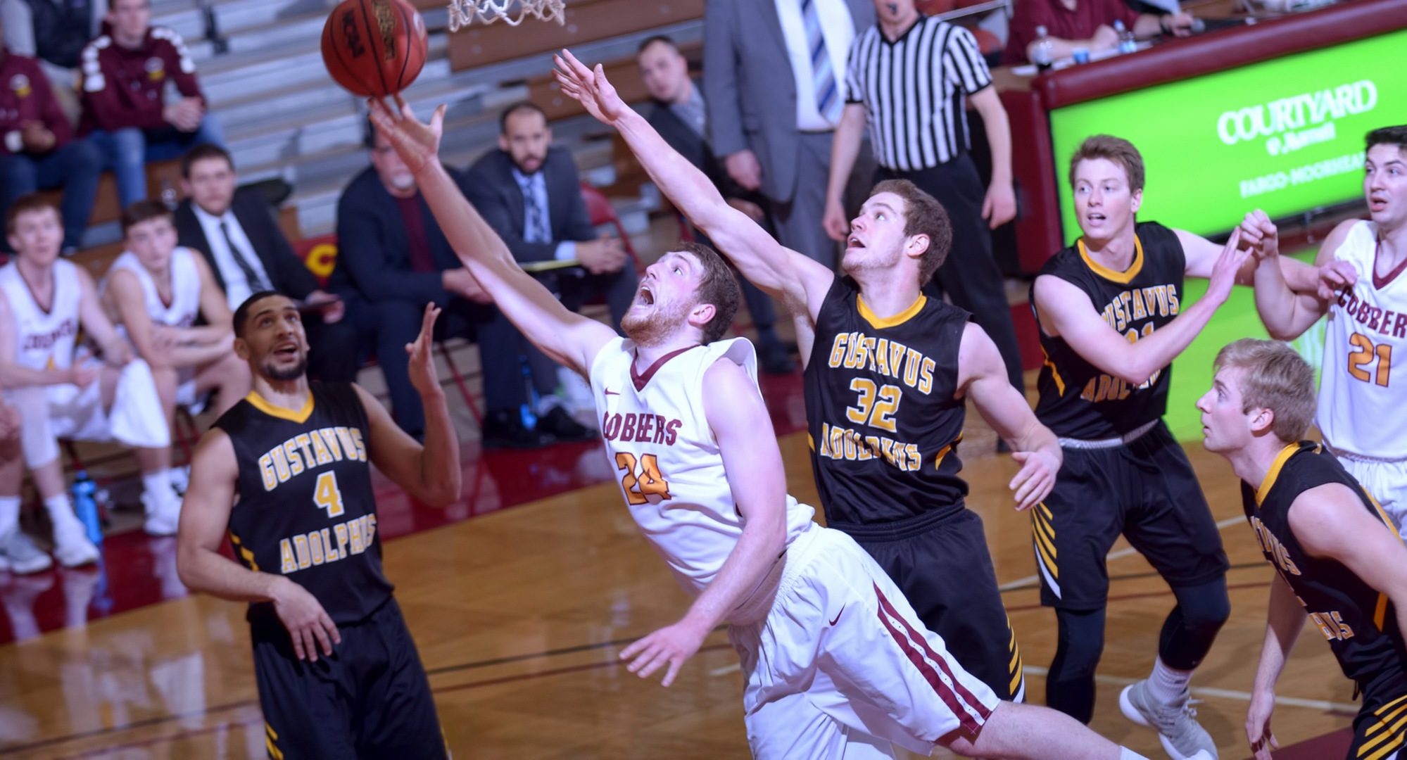 Mason Carpenter drives to the basket during the Cobbers' game with Gustavus. He finished with 10 points and was 4-for-4 from the free throw line.