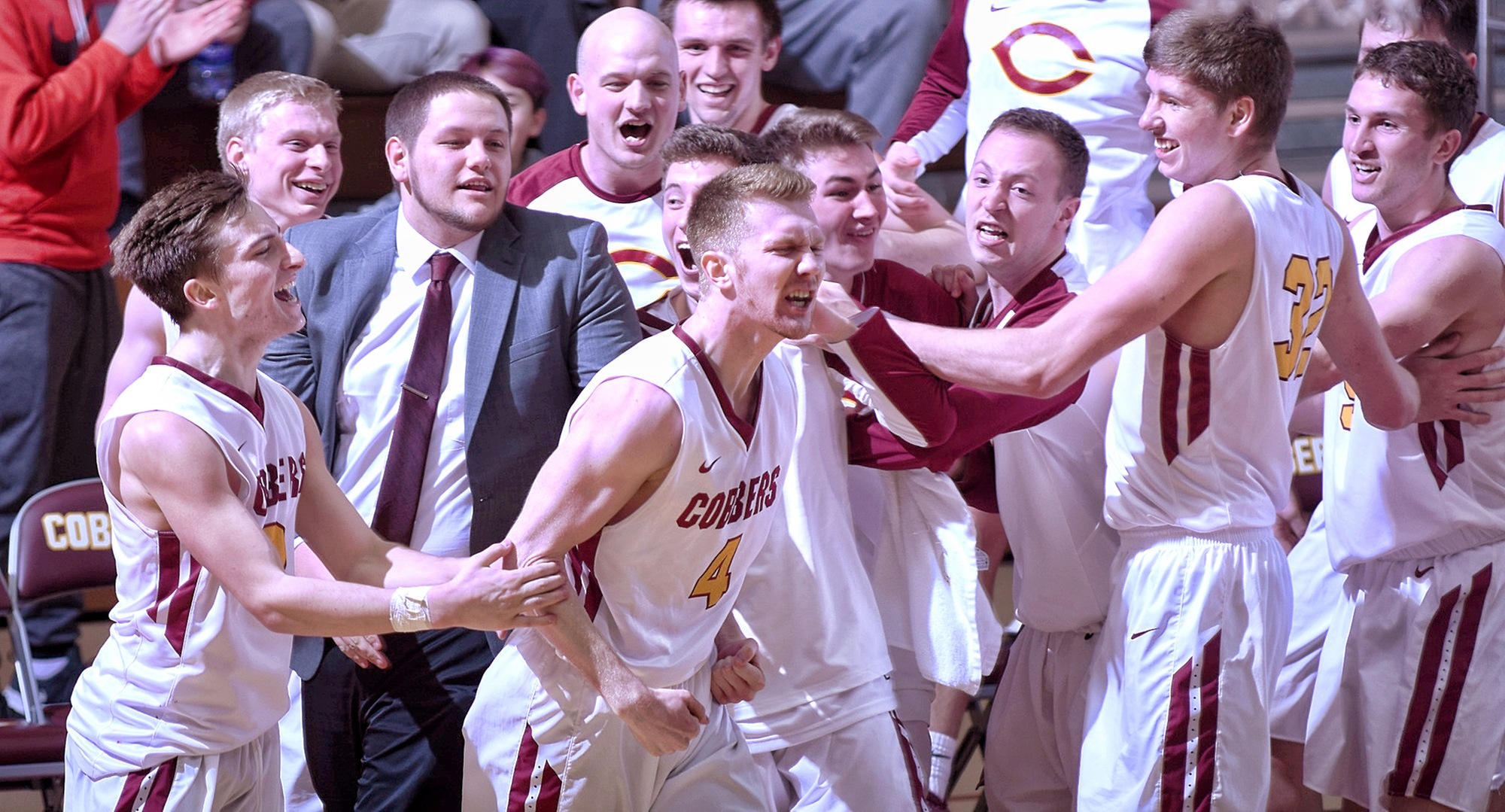 Collin Larson celebrates his game-winning half-court buzzer beater after the Cobbers' 79-76 win over Augsburg.