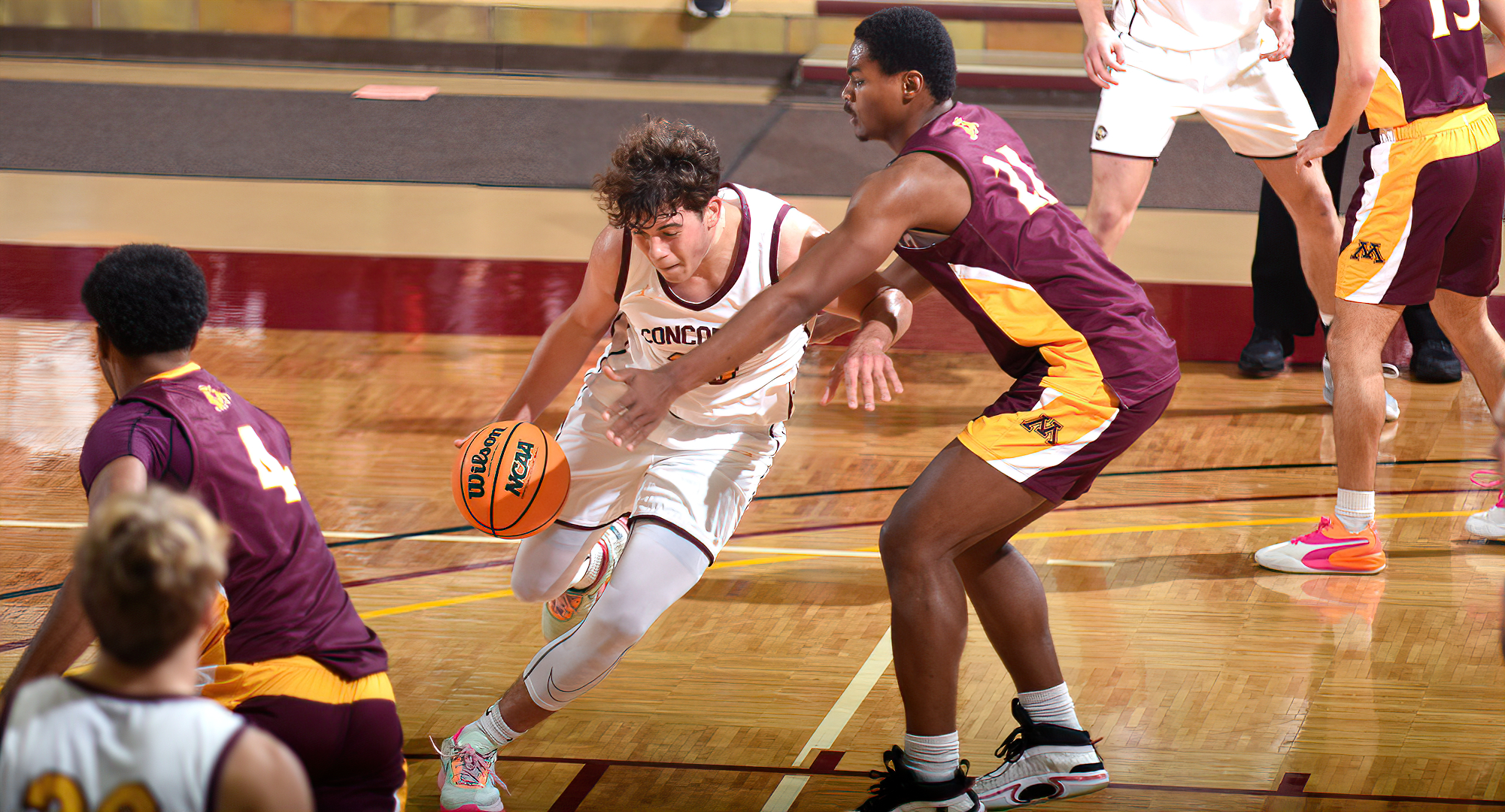 Freshman Jacob Cook drives to the basket for two of his team-high 12 points in the Cobbers' season opener against Minn.-Morris.