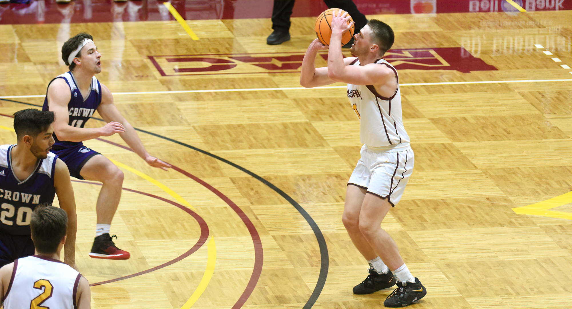 Matthew Johnson gets ready to drain one of his six 3-point shots on his way to a career-high 42 points in the Cobbers' game with Crown.