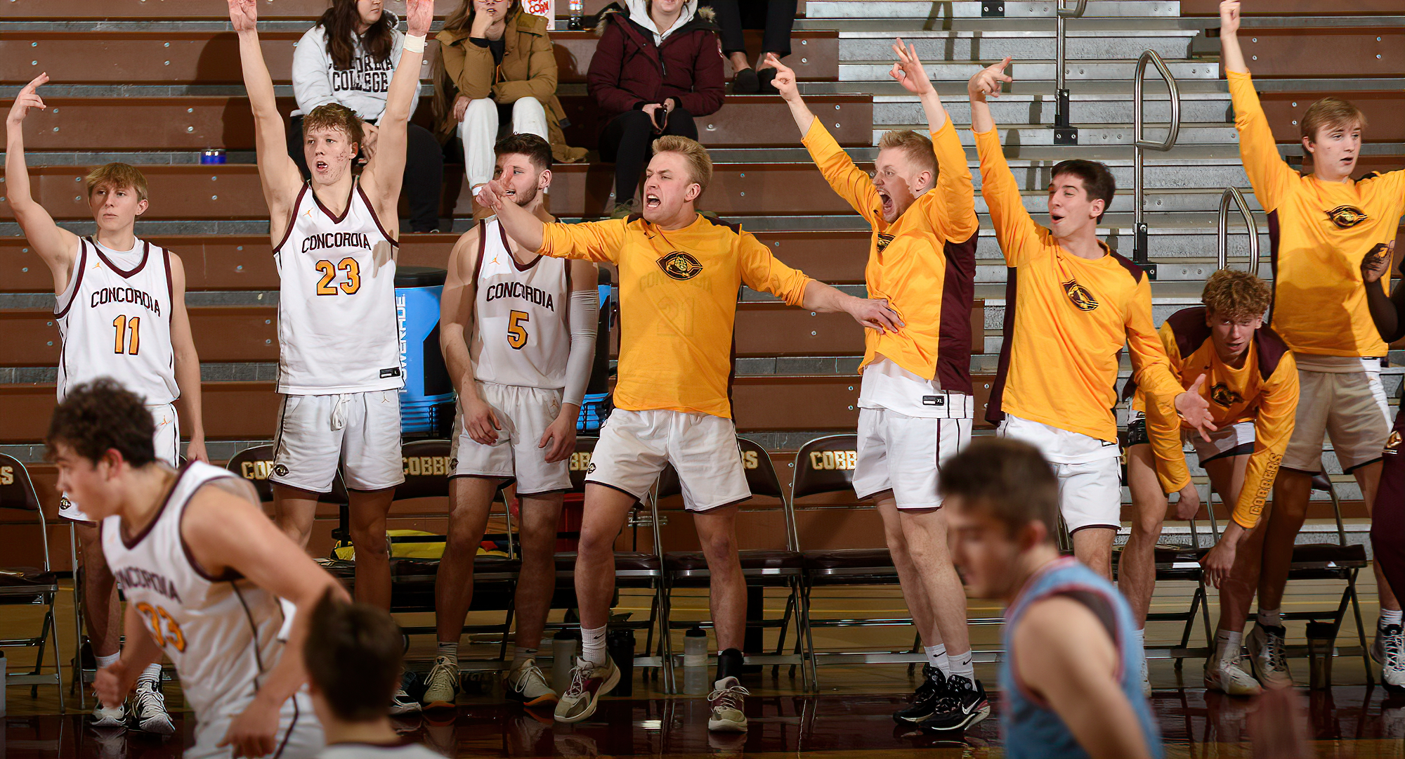 Concordia celebrates a huge basket during their 81-76 win over St. John's at home.