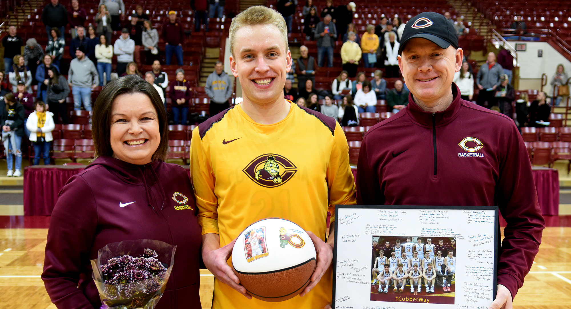 Senior David Birkeland, and his parents Lana and Jon, were  honored before the Cobbers' dramatic, last-second win over Hamline.