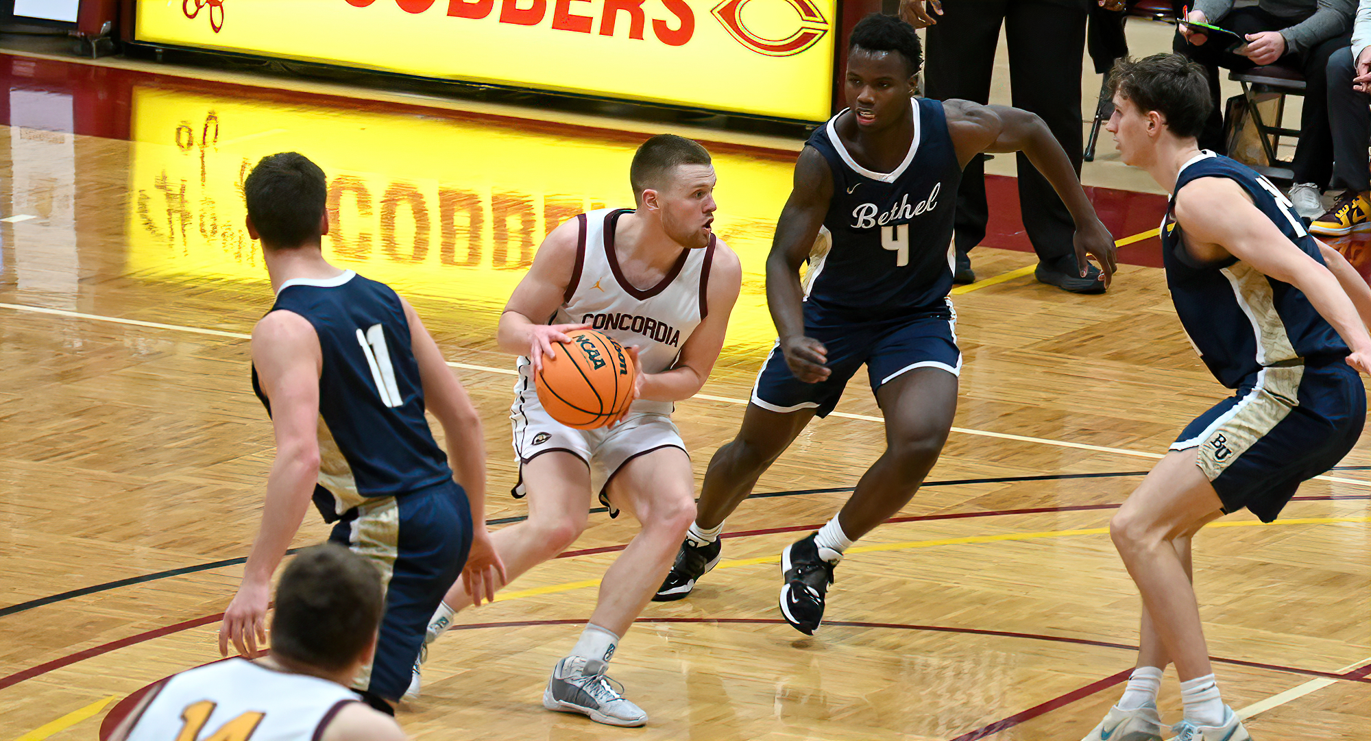 Senior Matt Johnson tries to drive through the Bethel defense in the second half of the Cobbers' game with the Royals.