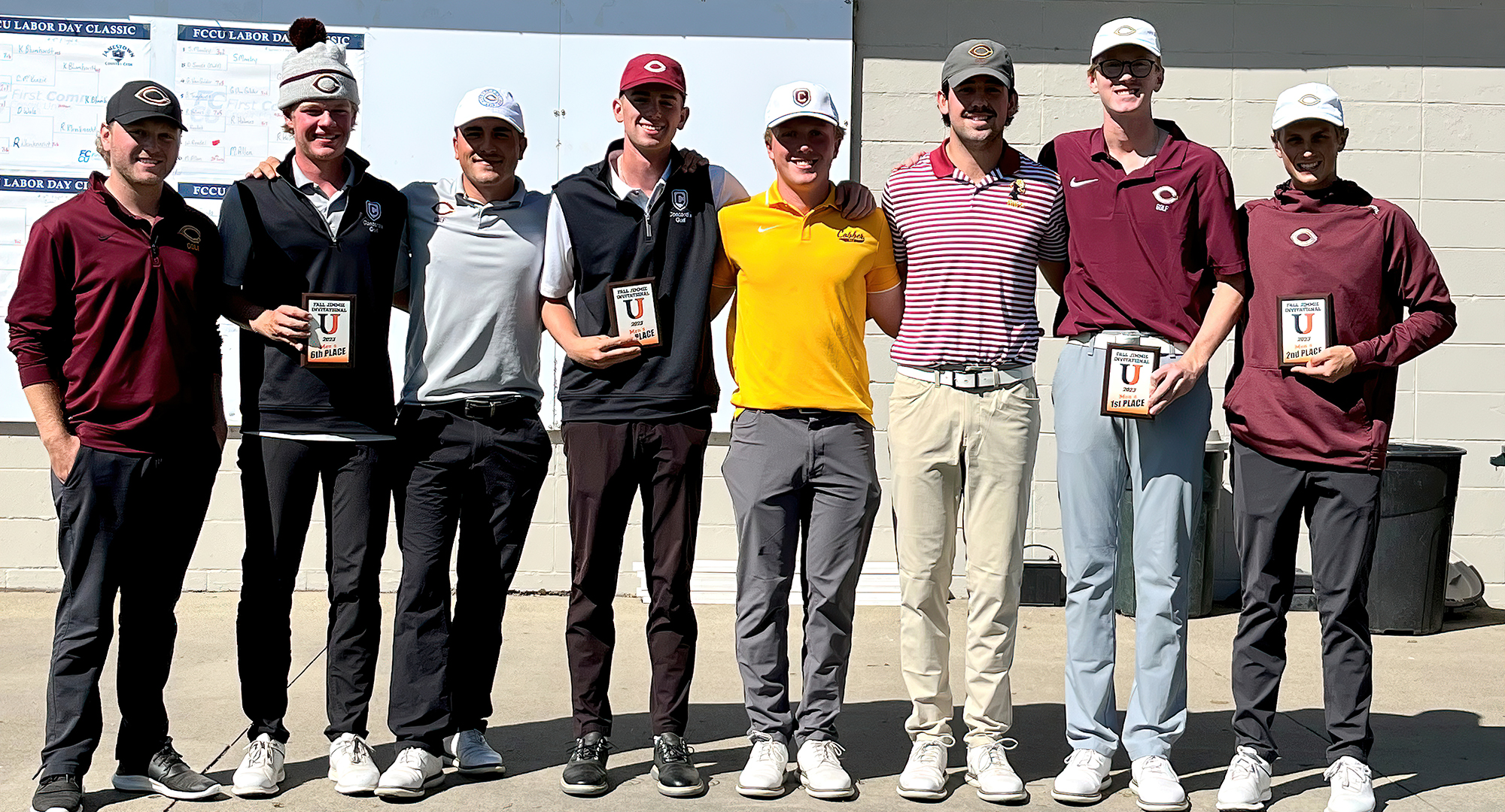 Concordia team members pose with their hardware after winning the Jamestown Fall Invite. CC shot a team score of 892 and won by three shots.