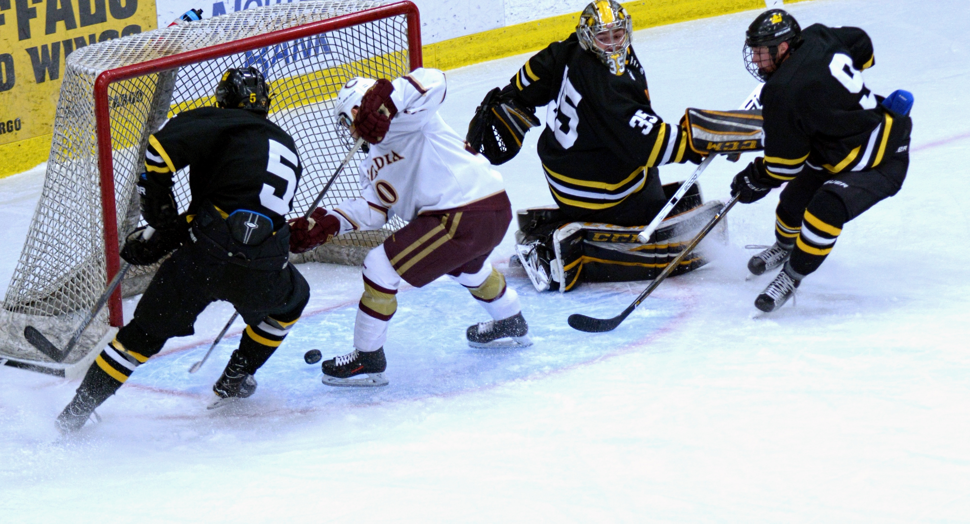 Senior Jeremy Johnson has the puck carom off his skate and into the net for the game-winning goal in the Cobbers' series opener with Gustavus.