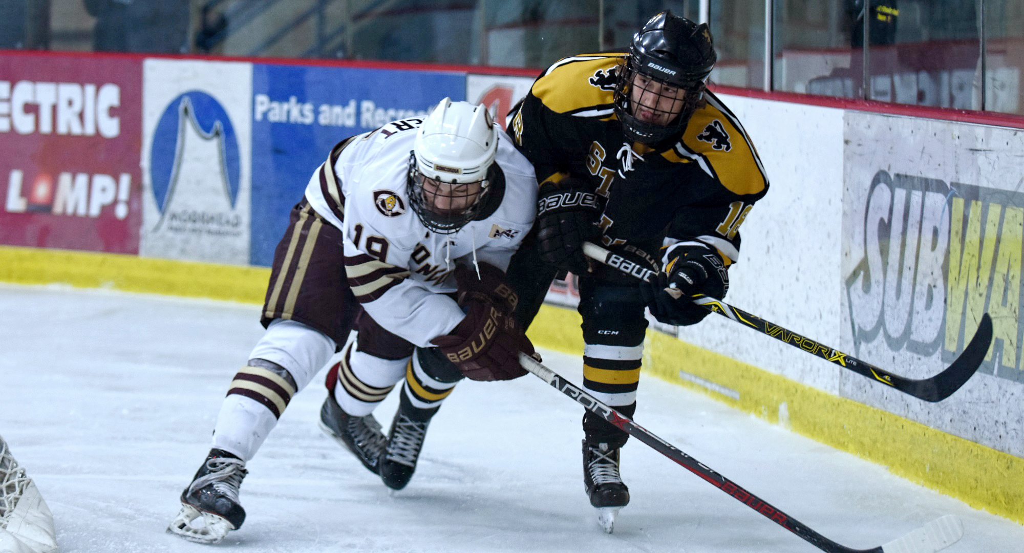 Sophomore Tyler Bossert tangles with one of the St. Olaf players during the Cobbers' 4-2 win. Bossert had a goal and two assists to help CC to the series sweep.