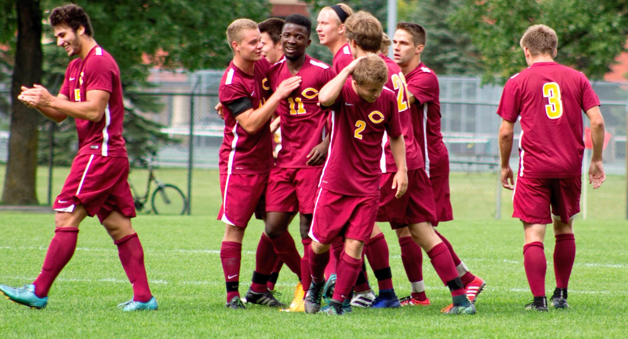 Concordia celebrates their second goal against Wis.-Superior. Goal scorer Matthew Fulks (left) came away with his first tally of the season.