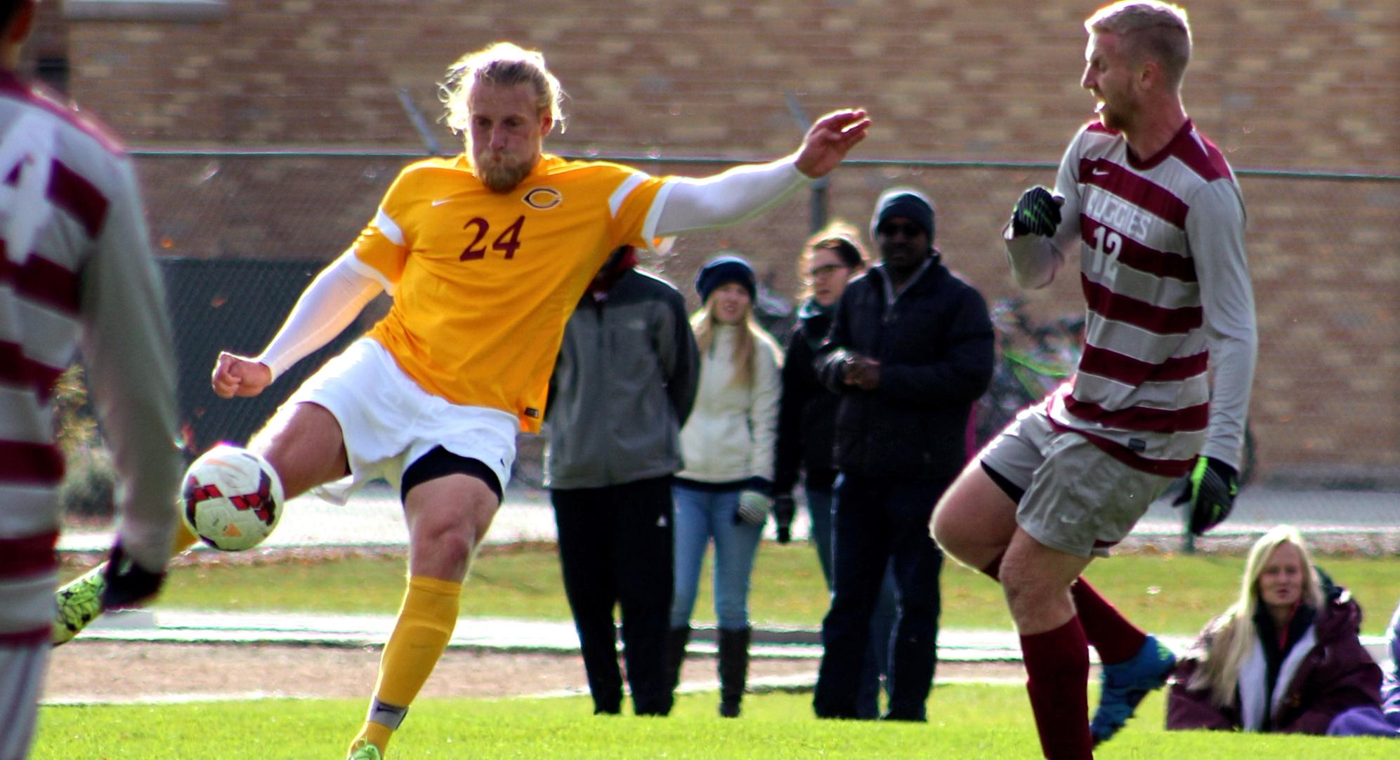 Sophomore Austin Peterson connects on a clearance volley during the Cobbers' game with Augsburg. Peterson scored his first collegiate goal in the second half.