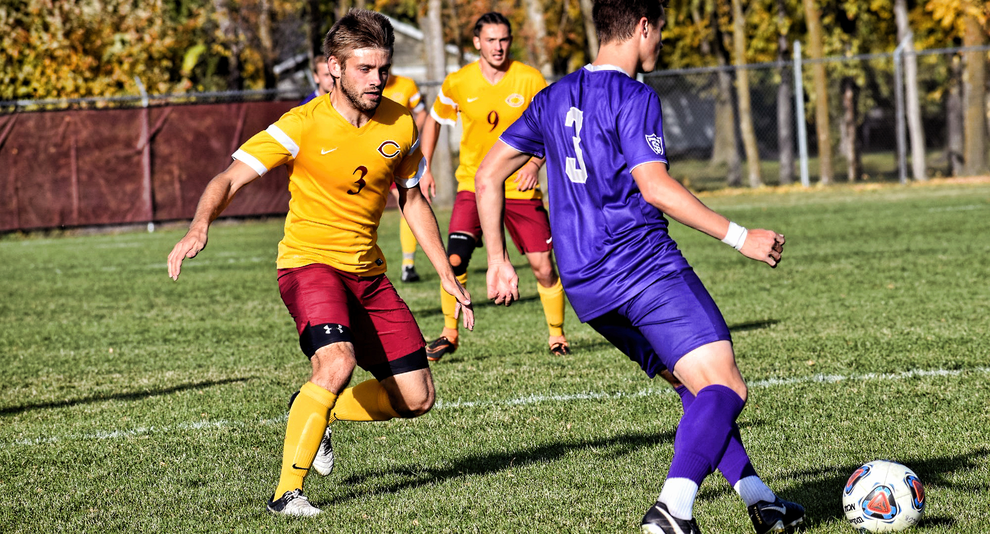 Senior defender Austin Promersberger tracks down a St. Thomas attacker in the Cobbers' game with the #5 Tommies. (Photo courtesy of Maddy Reed)