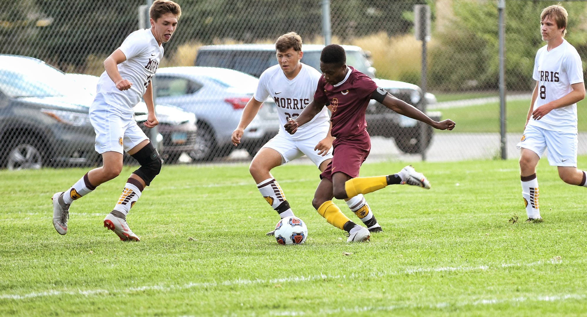 Senior Aronah Mukhtar is surrounded by three Minn.-Morris defenders as he tries to take a shot on goal. Mukhtar had a goal and an assist in the Cobbers' 4-1 win.