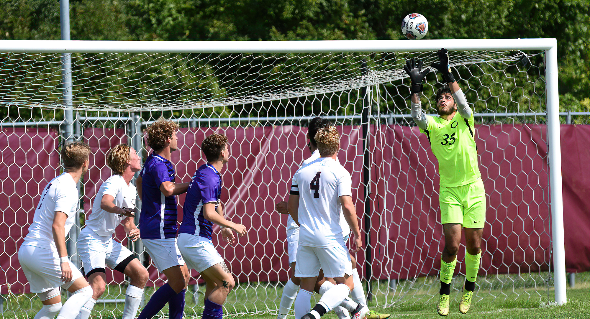 Cobber goalie Erick Torres goes up to grab a cross during the second half of Concordia's game with Loras.