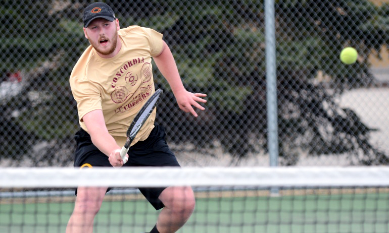 Junior Zach Biggar eyes his volley after coming to the net in his No.6 singles match vs. St. Cloud State.