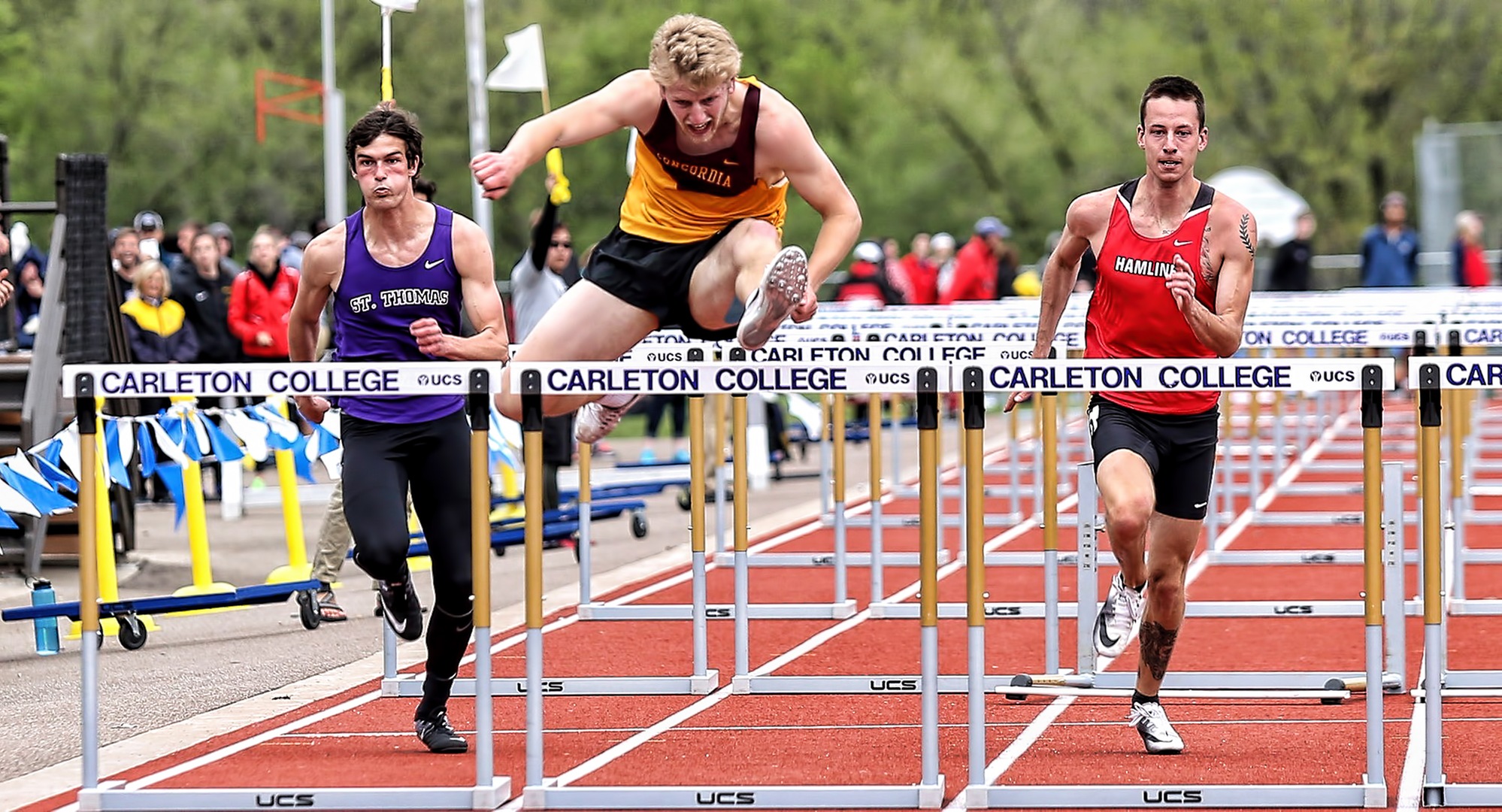 Sophomore Matt Bye clears the final hurdle on his way to a second-place finish in the 110-meter hurdles on Day 2 at the MIAC Championship Meet. (Photo courtesy of Nathan Lodermeier)