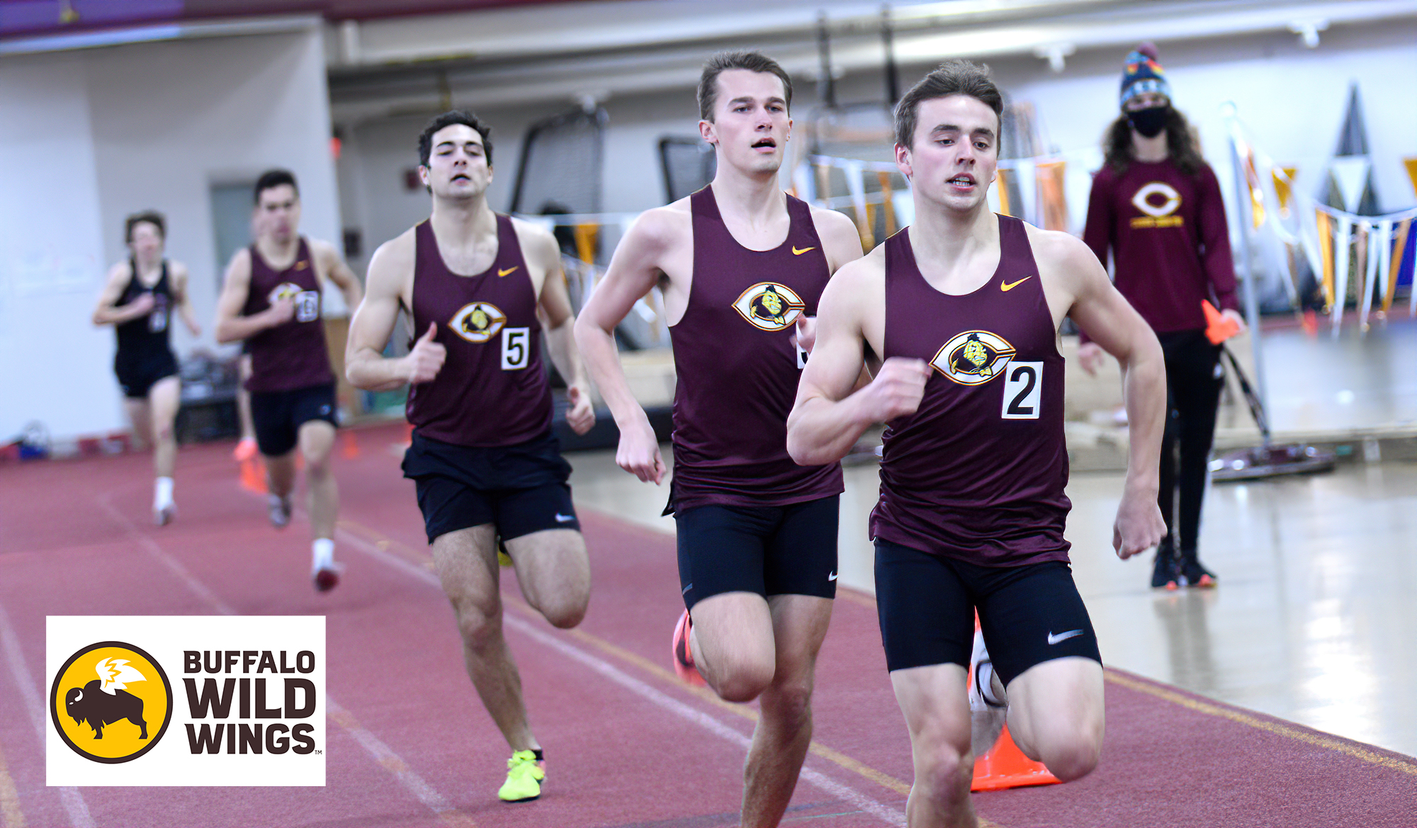 Dan Wilson (R) and Connor Haugrud lead a pack of Cobbers down the stretch in the 800 meters.