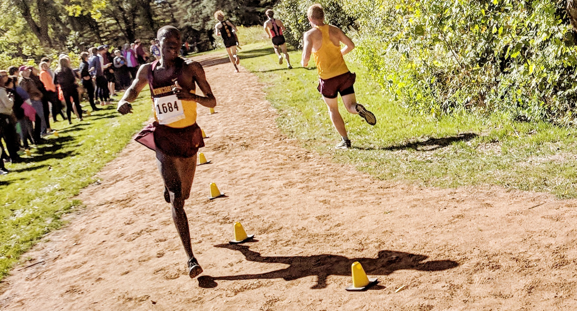 Cobber sophomore Munir Isahak turns the corner on his way to a second-place finish at the St. Olaf Invite.