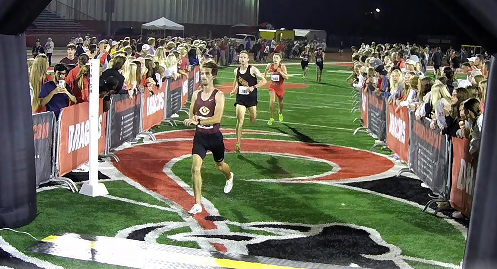 Tanner Olson crosses the finish line at the season-opening MSUM Twilight Meet. He posted a time of 19:07.80 and finished in 12h place.