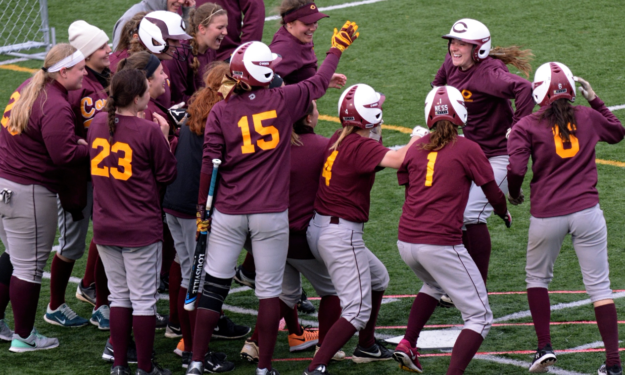 Sophomore Kayla Nack is all smiles as she gets set to cross home plate after her first career grand slam in the Cobbers' Game 1 win over Hamline.