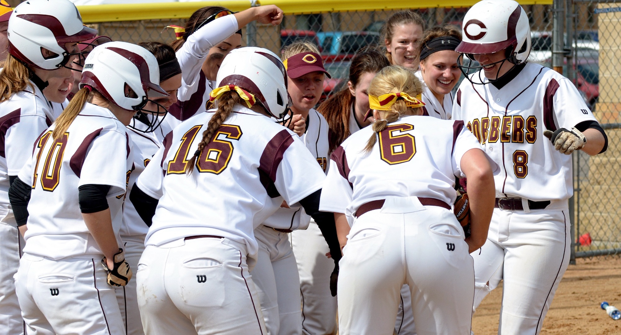 Sophomore Sydney Roberts (#8) gets ready to touch home plate after one of her two home runs in the Cobbers' MIAC opener against St. Benedict.