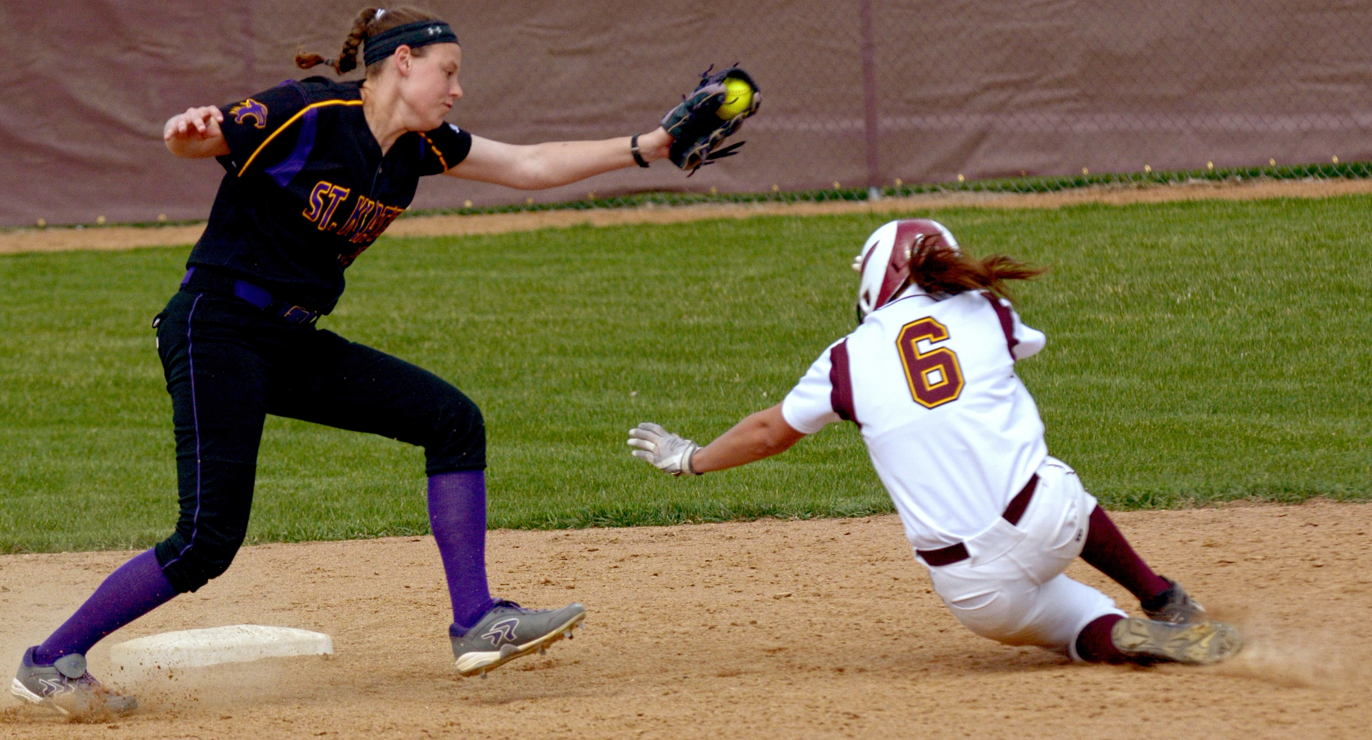 Senior Madison Little slides under the tag for her single-season record-breaking 25th stolen base during the Cobbers' DH with St. Catherine.