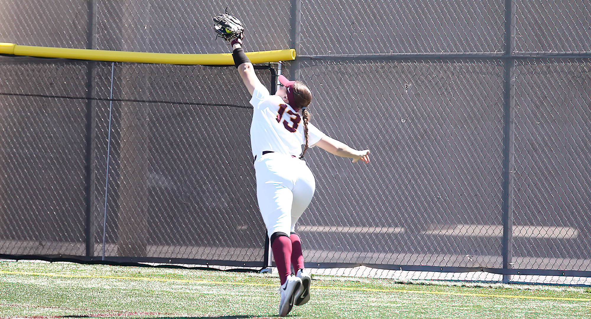 Kailee Falconer makes an over-the-shoulder catch in center field in Game 1 at Augsburg. (Photo courtesy of Ryan Coleman, D3photography).