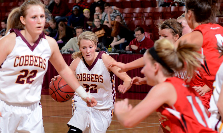 Alley Fisher drives for two of her team-high 17 points in the Cobbers' game against St. Benedict.