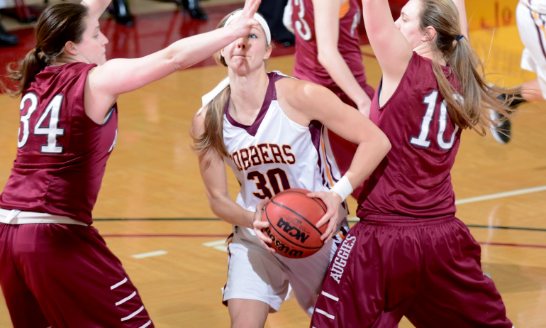 Erin Januschka drives to the basket for two of her team-high 12 points in the Cobbers' quarterfinal game with Augsburg.