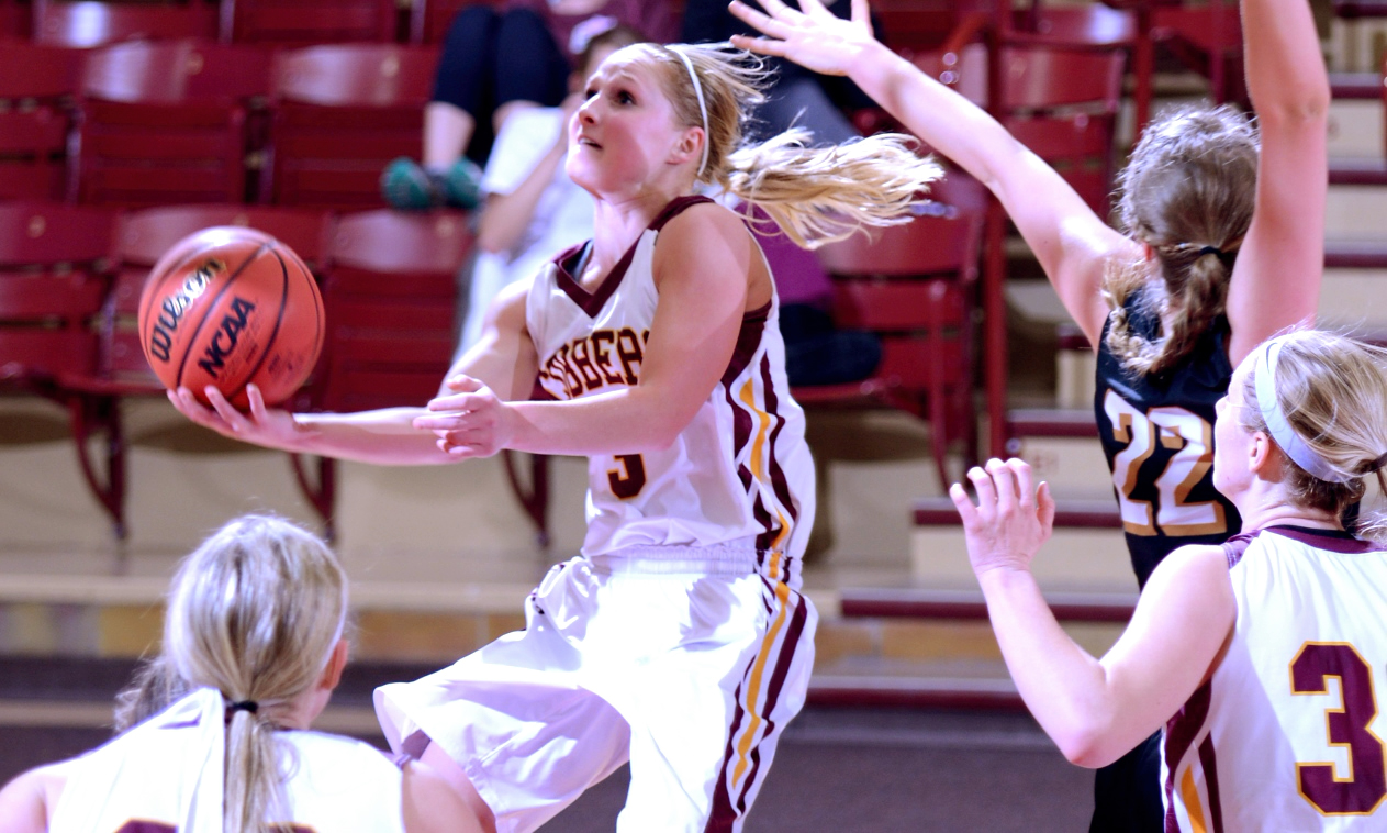 Junior Greta Walsh goes up-and-under for the scoop shot basket in the second quarter of the Cobbers 62-50 win over St. Olaf. Walsh had a game-high 18 points.