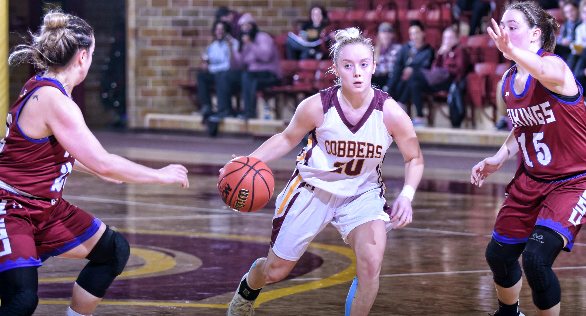 Sophomore Amber Lingen dribbles the ball to the basket during the Cobbers' home opener with Valley City St. She finished with a career-high 22 points.