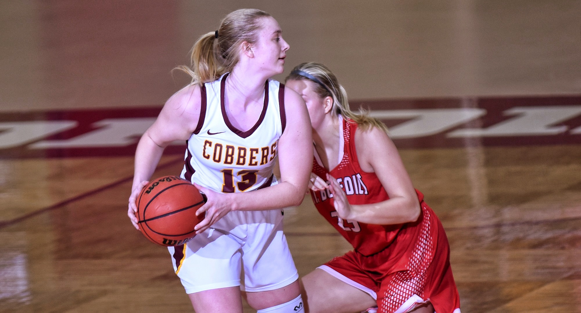 Sophomore Bailee Larson looks to make a pass in the second half of the Cobbers' win over St. Ben's. She had a career-high 15 rebounds in the game.