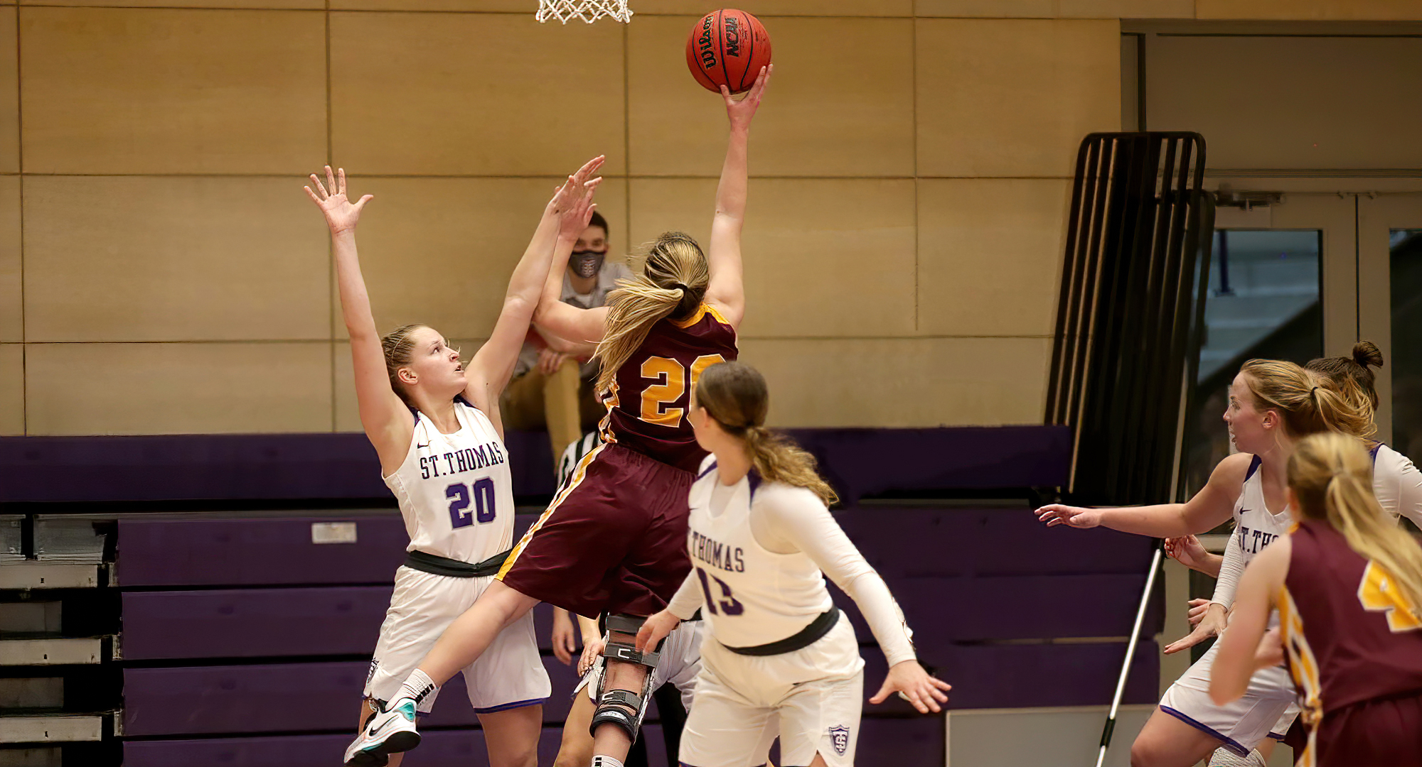 Emily Beseman drives to the basket to drop in two of her game-high 25 points during the Cobbers' game at St. Thomas. (Photo courtesy of D3photography.com)