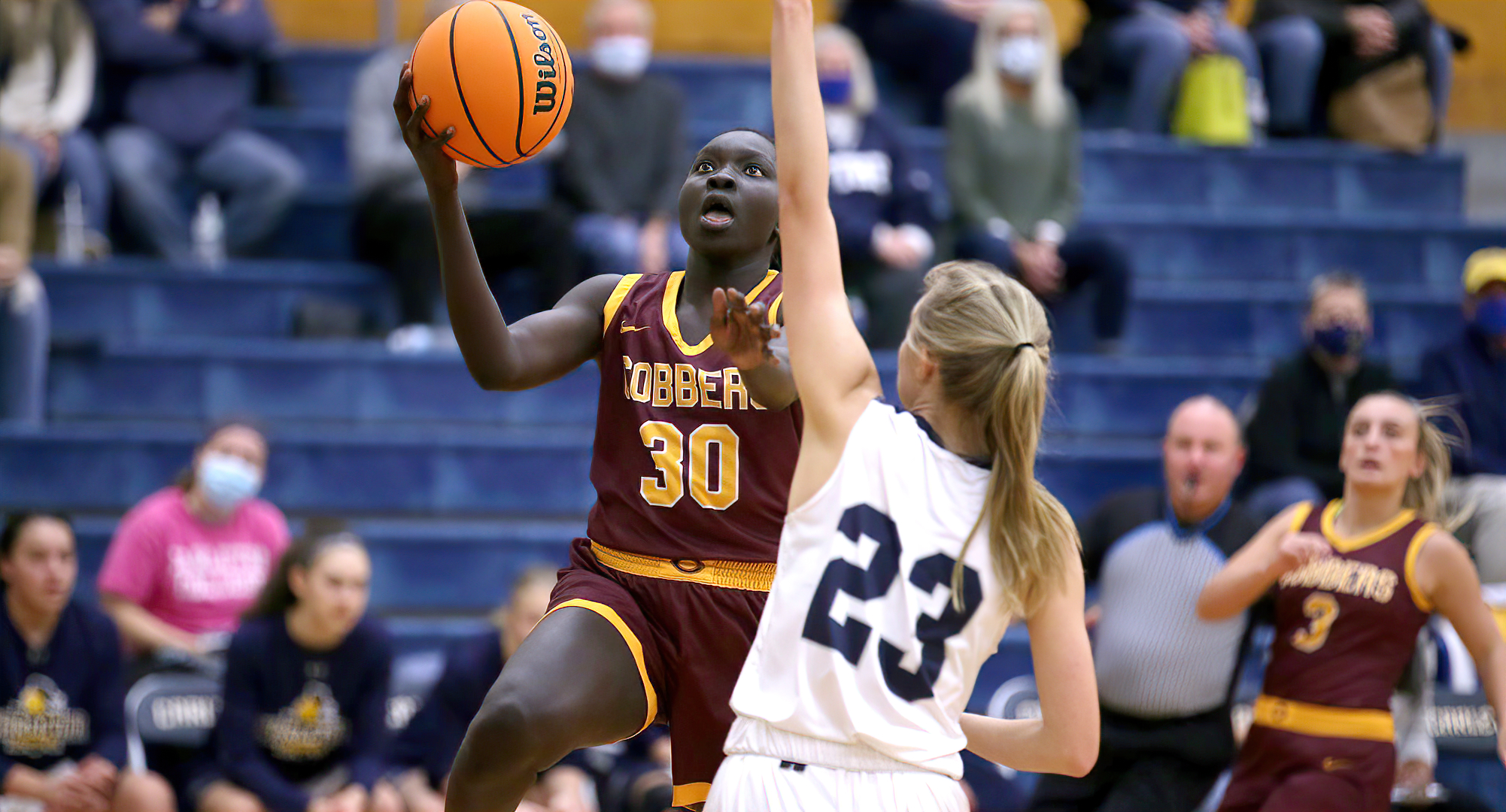 Mary Sem lays in two of her 13 points during the first half of the Cobbers' game at Carleton (Photo courtesy of Ryan Coleman, D3photography)