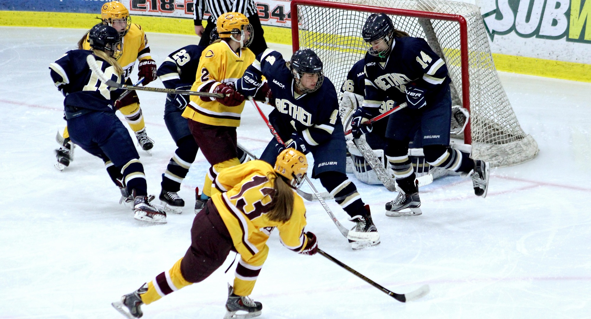Senior Jessie Kongelf (#13) follows through on her goal in the first period of the Cobbers' 7-3 win against Bethel in the regular-season finale.