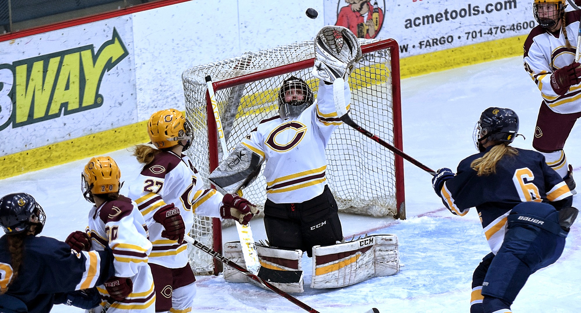 Freshman goalie Emily Musielewicz does her best Joe Mauer impersonation as she snages the puck out of midair during the Cobbers' game with #10 Wis.-Eau Claire.