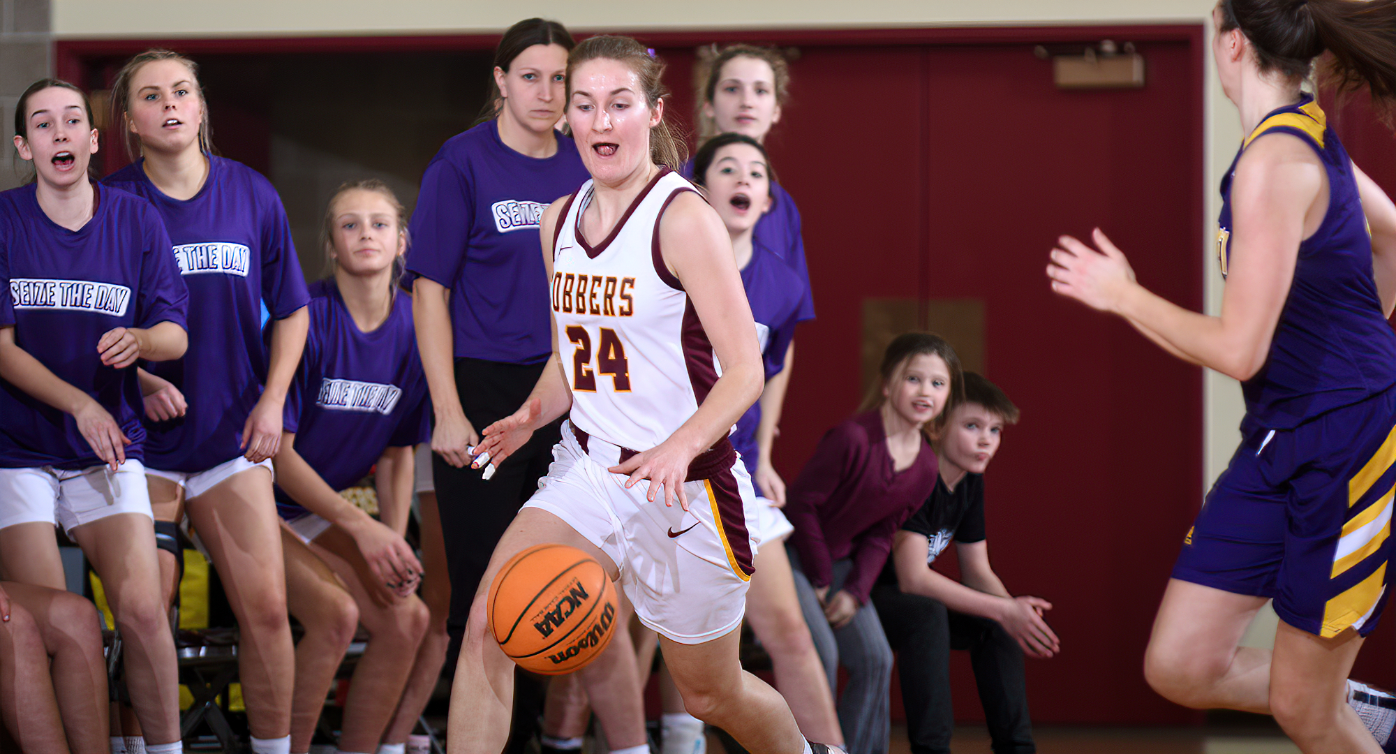 Jordyn Kahler brings the ball up the court during the Cobbers' game with St. Catherine. Kahler finished with a team-high seven rebounds.