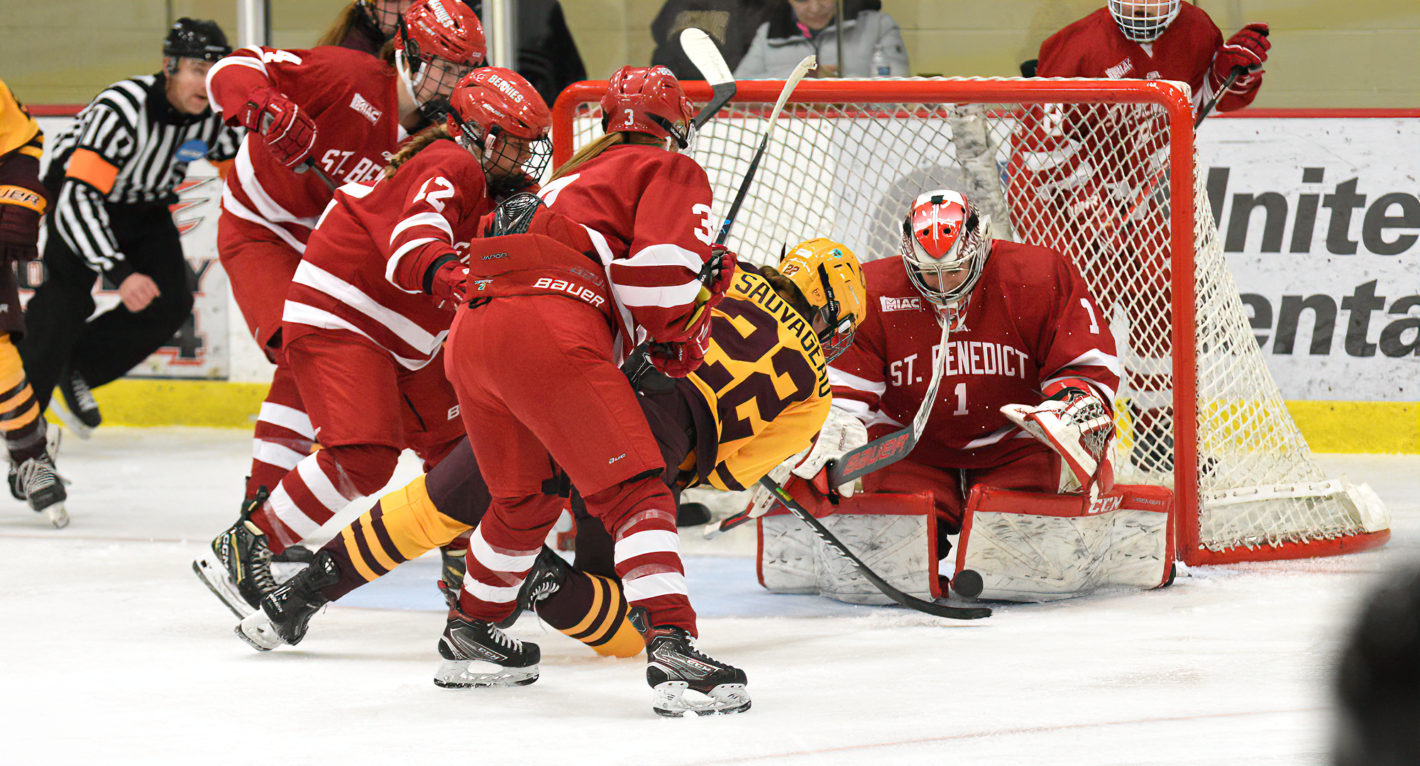Morgan Sauvageau gets knocked to the ice by a pair of St. Ben's defenders as she tries to connect on the game-tying goal in the third period.