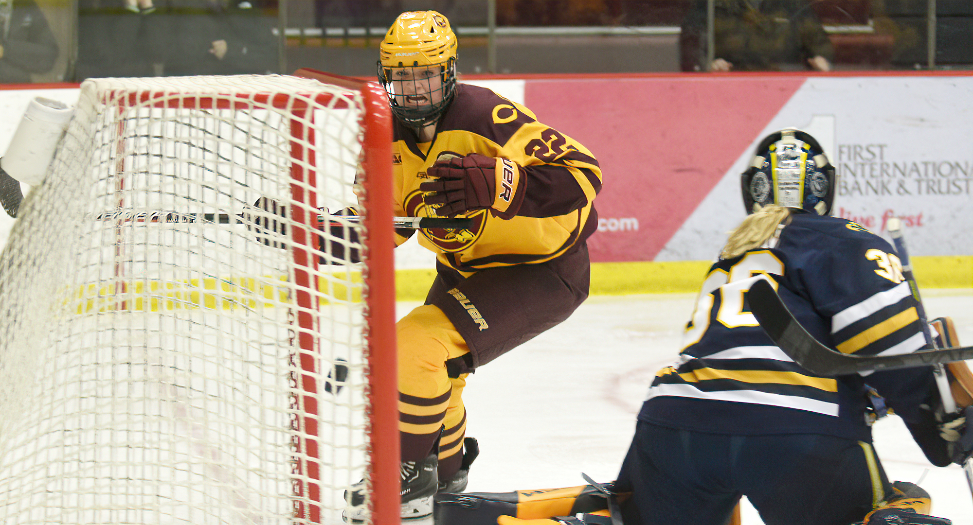 Freshman Morgan Sauvageau watches her shot go into the goal in the second period of the Cobbers' 5-2 win over St. Scholastica in the series finale.