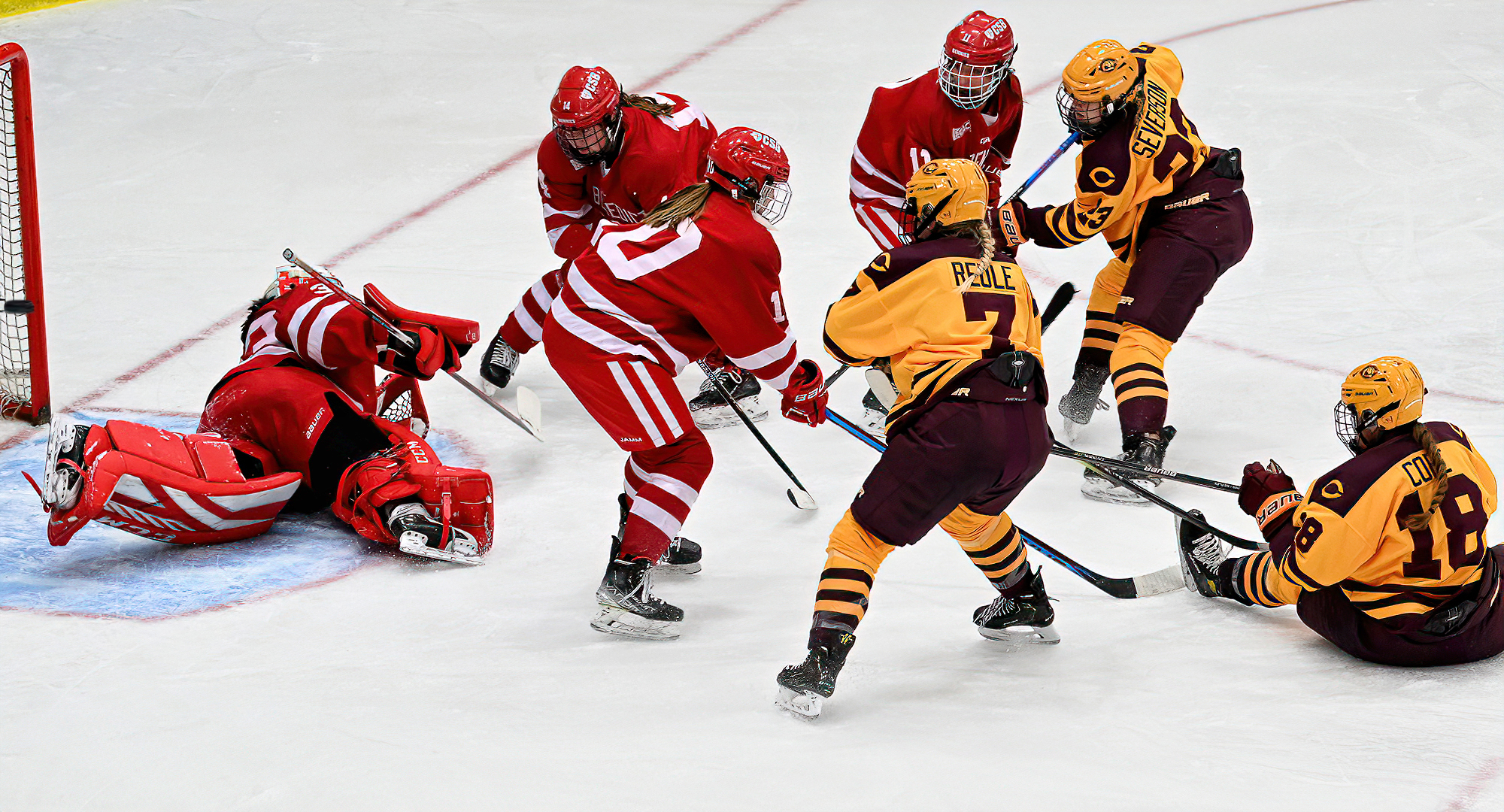 Taylor Severson (#23) fires the puck past the St. Ben's goalie for her first college goal in the second period of the Cobbers' game with the Bennies.