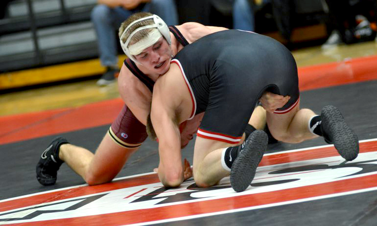 Jake Krogstad battles his opponent at 165 in the dual vs. #5 St. Cloud St. (Photo courtesy of SCSU Sports Information Dept.)