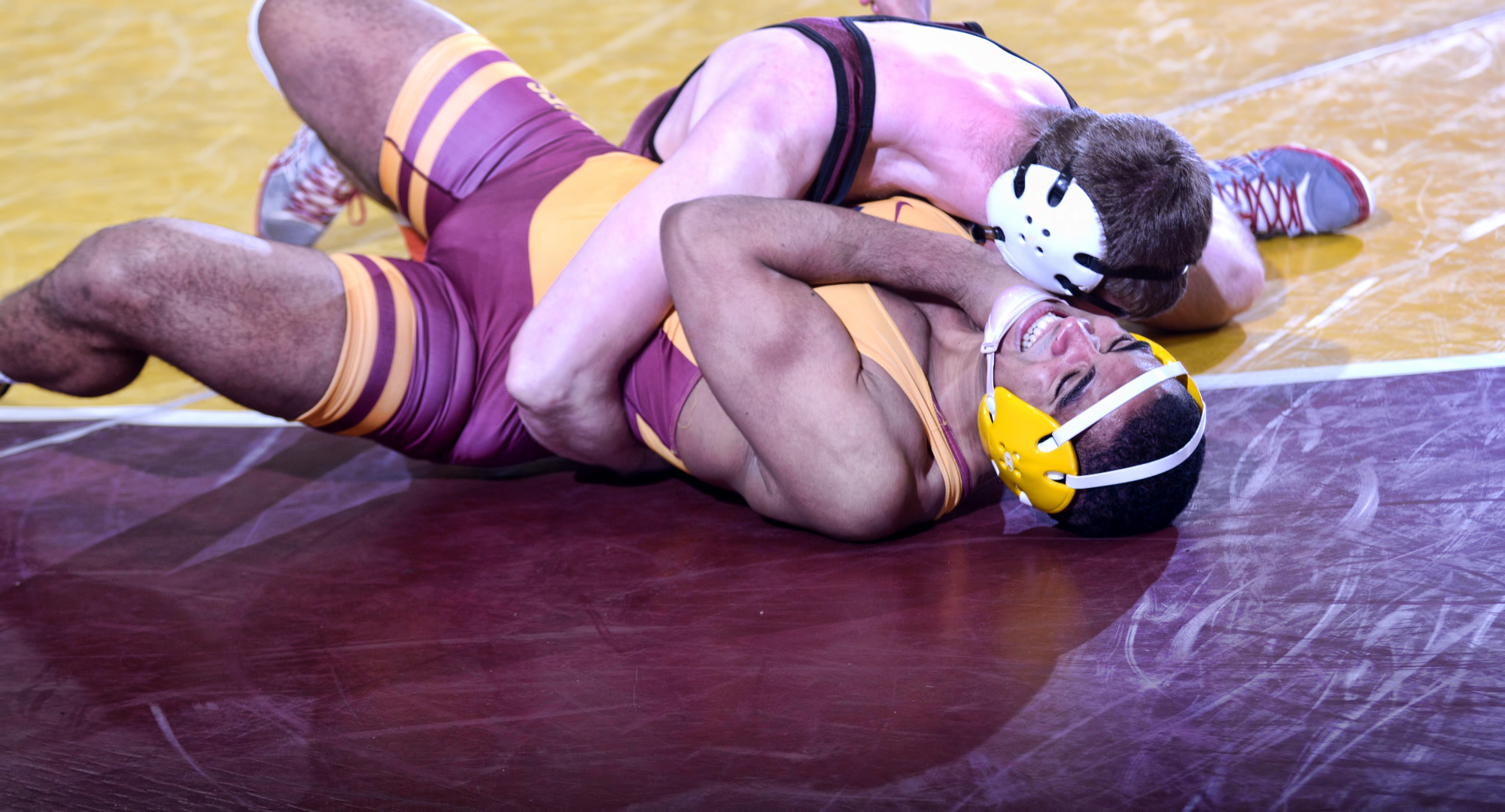 Freshman Ethan Kimber gets his opponent on his back seconds before gaining the dual-deciding pin in the Cobbers' 20-17 win over Northern State.